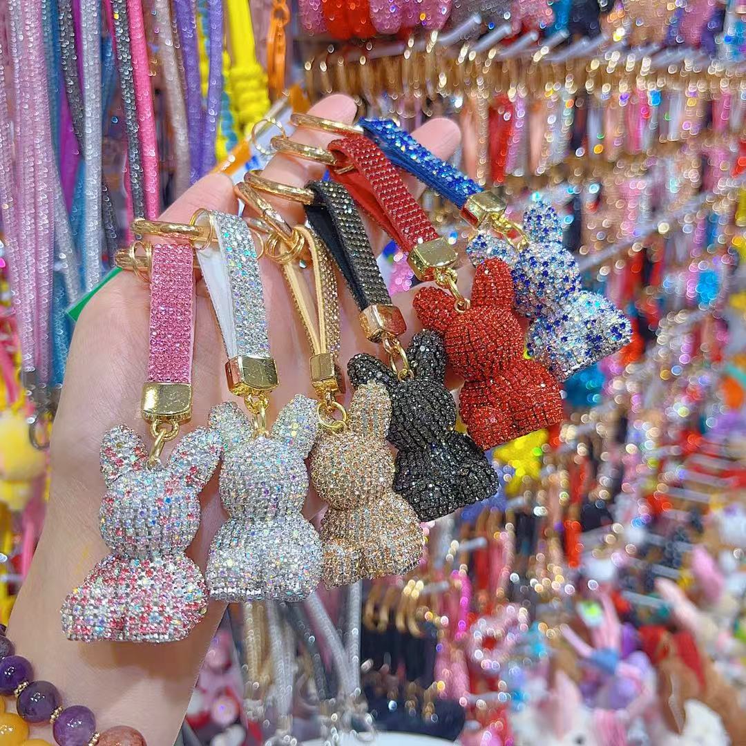 Venta directa de fábrica de lujo completo diamante muñeca llavero pajarita cabeza grande oso completo diamante bolsa colgante coche llavero