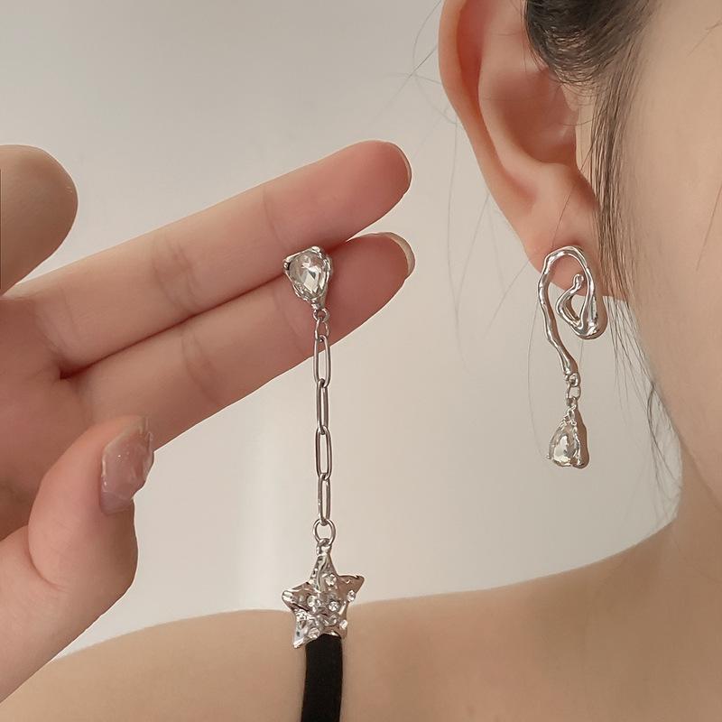 Small design asymmetrical summer earrings with zircon