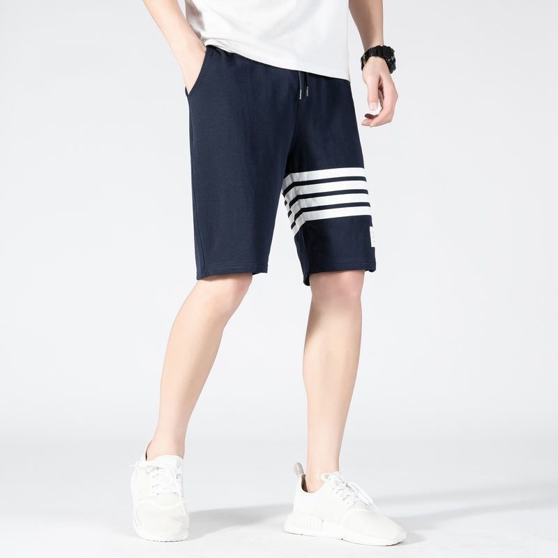 Nuevos pantalones cortos de estilo americano de verano de moda masculino delgado diseño de nicho relajado pantalones deportivos casuales de cinco puntos