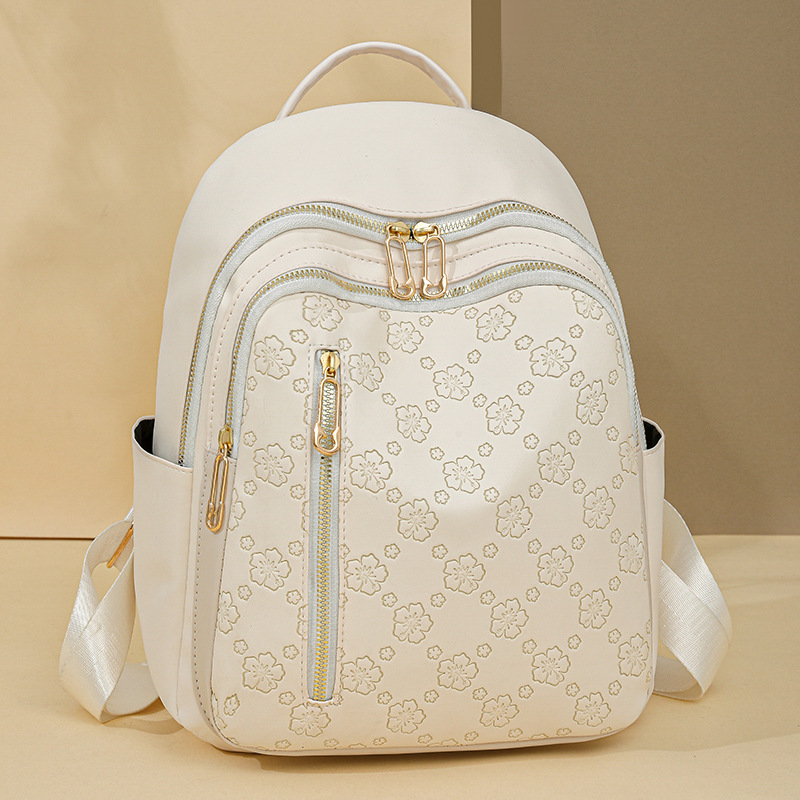 Spot al por mayor 2025 primavera nuevo estilo color sólido mochila para mujer moda urbana viajero ligero mochila escolar