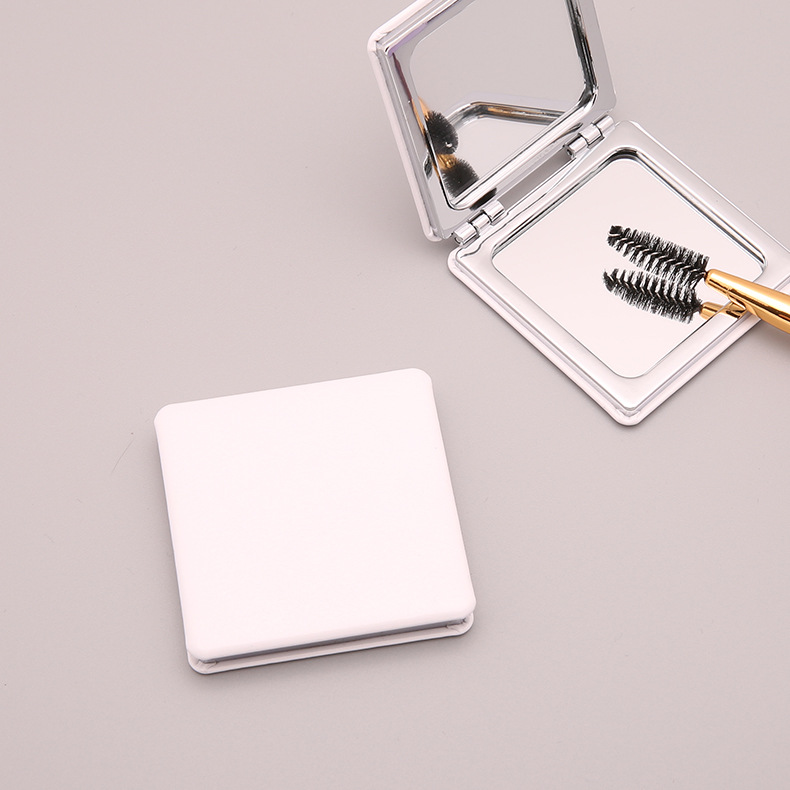 Crayón pequeño nuevo espejo de fábrica directamente para portátil plegable espejo de maquillaje estudiantes de mano comedor lindos bolsos nuevos