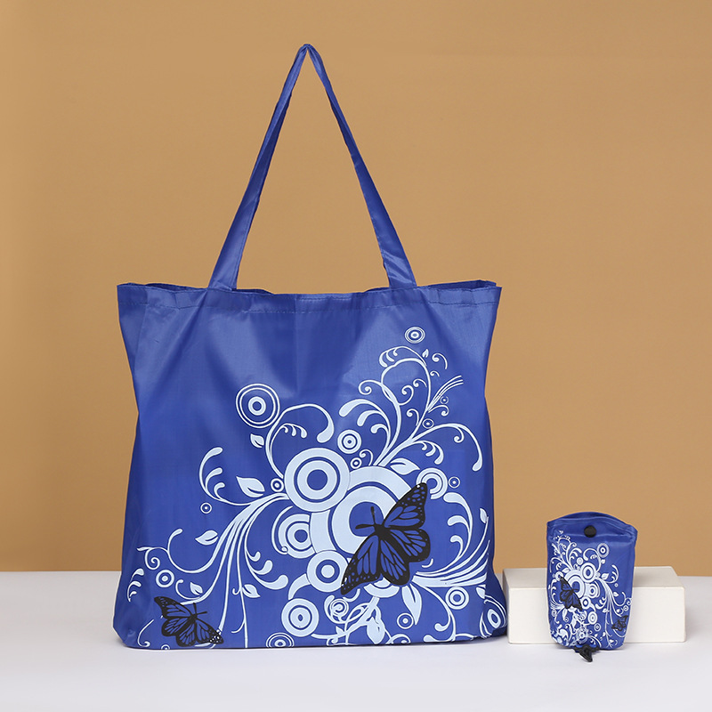 Bolsa de compras plegable de flores de mariposa Portátil Bolsa de protección ambiental en stock logotipo imprimible bolsa de almacenamiento de tela de poliéster Oxford