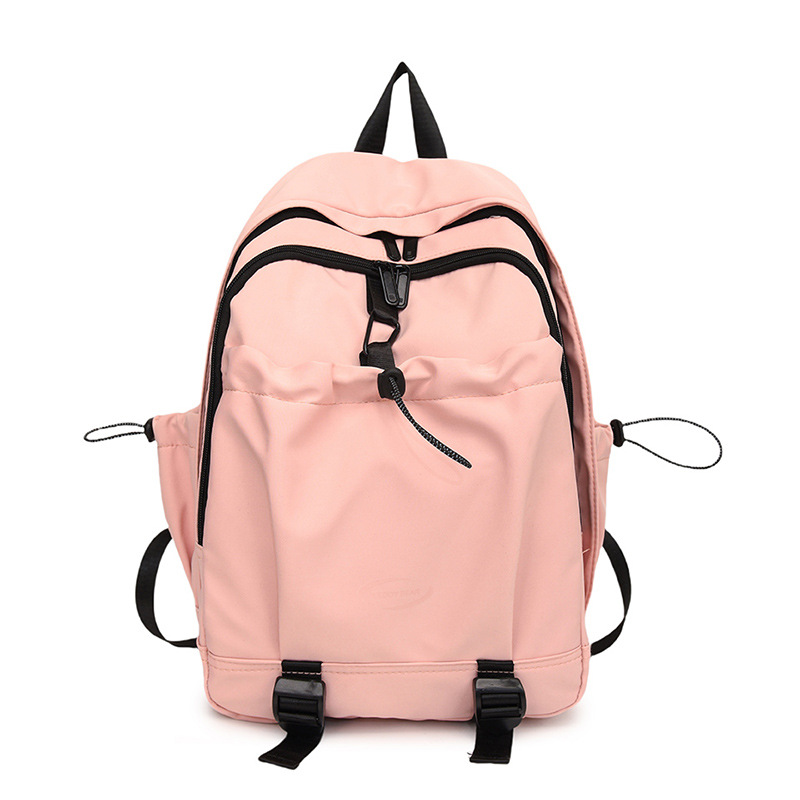 Nuevo estilo coreano transfronterizo de color sólido simple y versátil para estudiantes de escuela primaria y secundaria de alta capacidad mochila de viaje