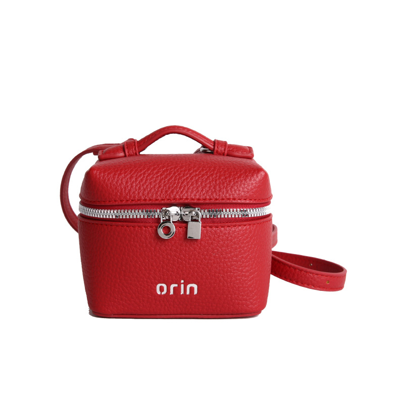 2026 nuevo bolso infantil coreano litchi patrón bolso de caja para hombres y mujeres bolso de cambio de color sólido mini