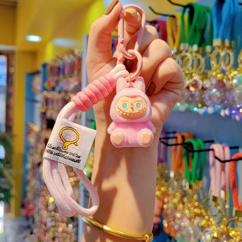 Caricatura floc amarelis llavero de automóvil pareja colgante bolsos creativos colgar garra máquina regalos al por mayor