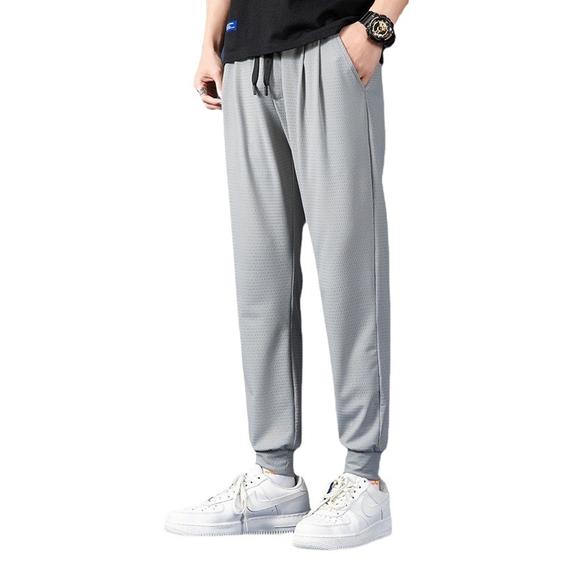 Malla transpirable pantalones atados al tobillo primavera y verano nuevos hombres de cintura elástica de seda de hielo deportes casuales pantalones de color sólido