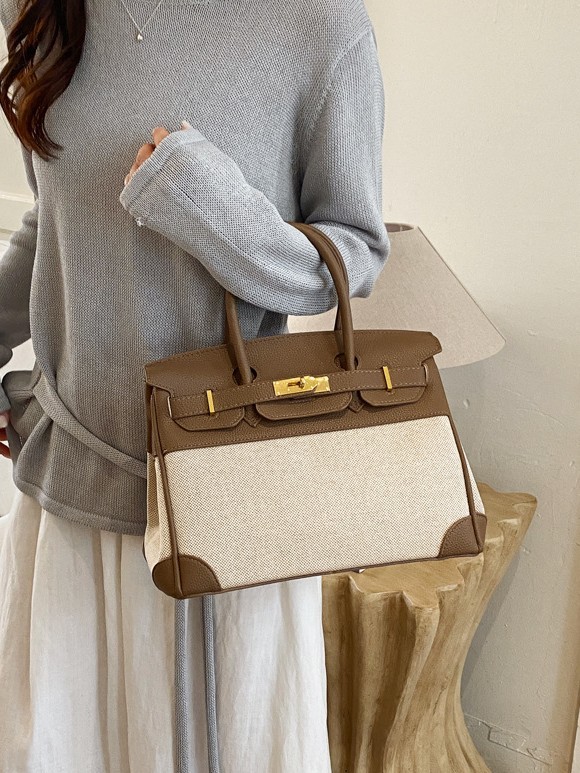 Cross-border nuevo bolso portátil de platino para mujeres 2026 moda lino empalme color contraste mochila de hombro