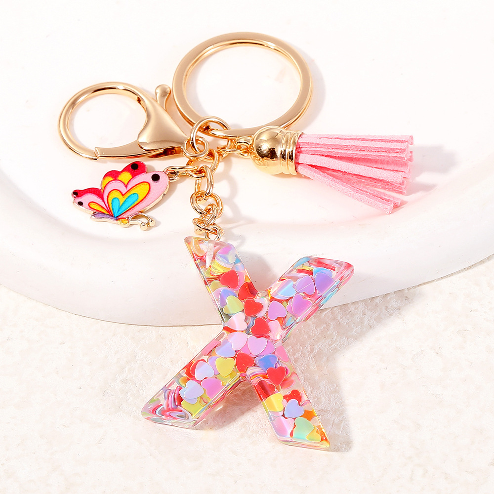 2024 puntos transfronterizos de resina de sequilla rosa 26 letras inglesas llavero colgante mariposa fringe accesorios