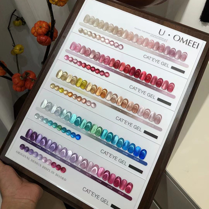Nuevos productos de la Expo, la serie de escamas de brocado, pegamento de ojos para gatos, 50 colores, un conjunto completo de cuentas de vidrio, pegamento de esmalte de uñas, color de moda.