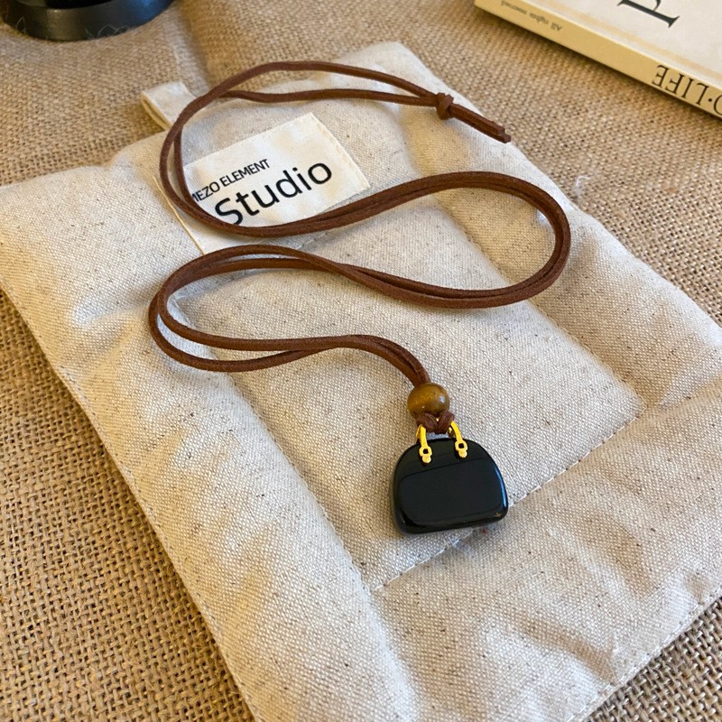 Nuevo estilo de cuero chino, colgante, collar de borlas, estilo étnico femenino, cadena de suéter retro de nicho, moda, artículos de alta gama