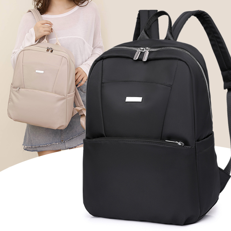 Mochila para computadora de 14 pulgadas de gran capacidad 2024 nueva mochila de viaje ligera de nailon casual mochila escolar simple de color sólido