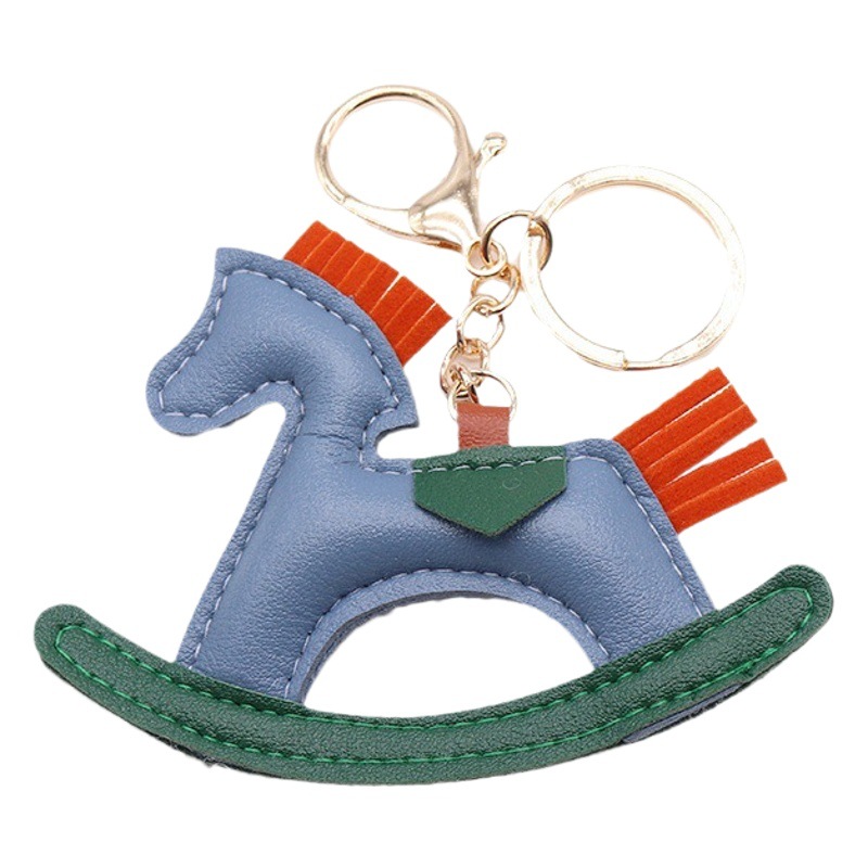 PU de cuero troyano llavero al por mayor creativo llavero de cuero carrusel llavero colgante caballo mecedora