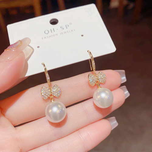 Japanese and Korean exquisite and fashionable ultra-glitter micro-paved zircon bow pearl ear hooks elegant and high-quality earrings wholesale