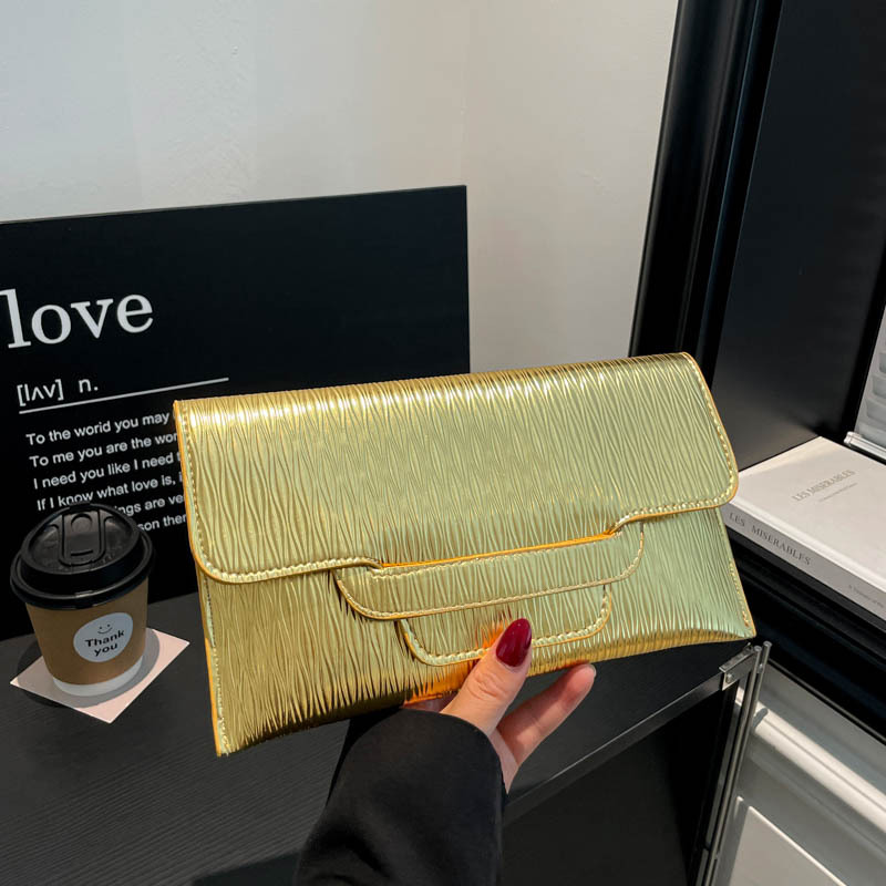 Bolsa de cena de color sólido para mujeres 2026 nueva moda ocio de gran capacidad temperamento personalidad bolso de cambio bolso de mano