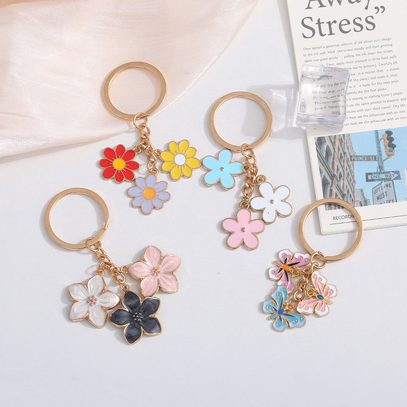 Cross-border alloy oil drop flower keychain sweet cute multi-color butterfly mobile phone bag pendant pendant wholesale