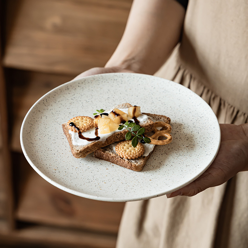 Plato de cerámica esmalte de sésamo retro platos de comedor occidentales platos de cubierta domésticos platos redondos al por mayor platos de postres platos de desayuno platos