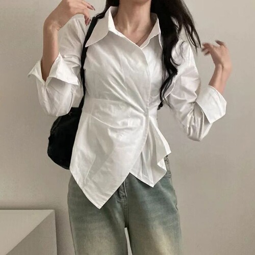 A stylish women's new spring collared shirt with a design featuring irregular cinched waist for a slimming effect, striped long sleeves, and a trendy vibe.