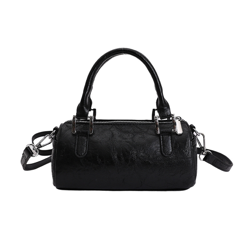 Nicho de diseño retro bolso de mano mujer 2026 primavera nuevo bolso de hombro sensación diaria de moda oblicuo bolso cilíndrico