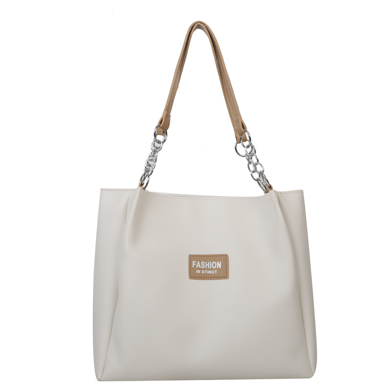 Bolsa de viaje de textura de moda de gran capacidad 2023 primavera y verano nuevo color de contraste solo hombro bolsa de axilas elegante bolsa de mano moda