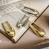 Golden geometric design advanced metal earrings, European style, high-quality style