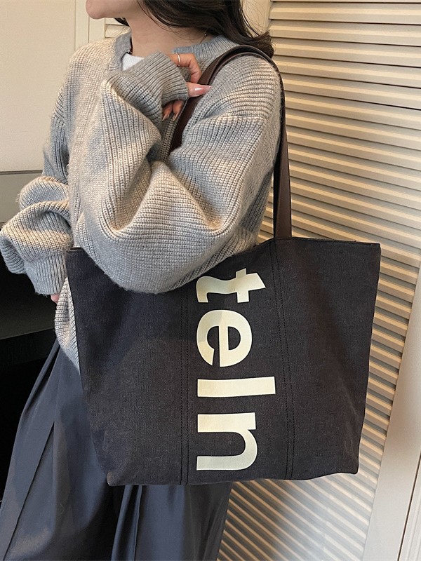 2026 nueva bolsa de hombro coreana versátil bolsa de lona casual para estudiantes universitarios de clase simple bolsa de viaje diario