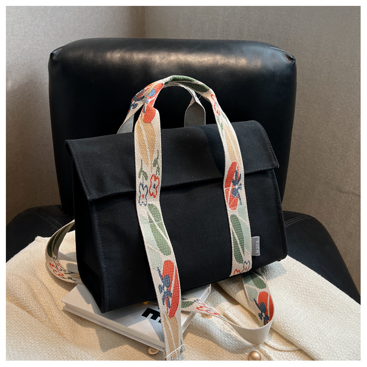 Comercio exterior bolsa de lona para las mujeres 2023 nueva moda japonesa y coreana bolsa de mano portátil nicho de alta calidad bolsa de mensajero del hombro