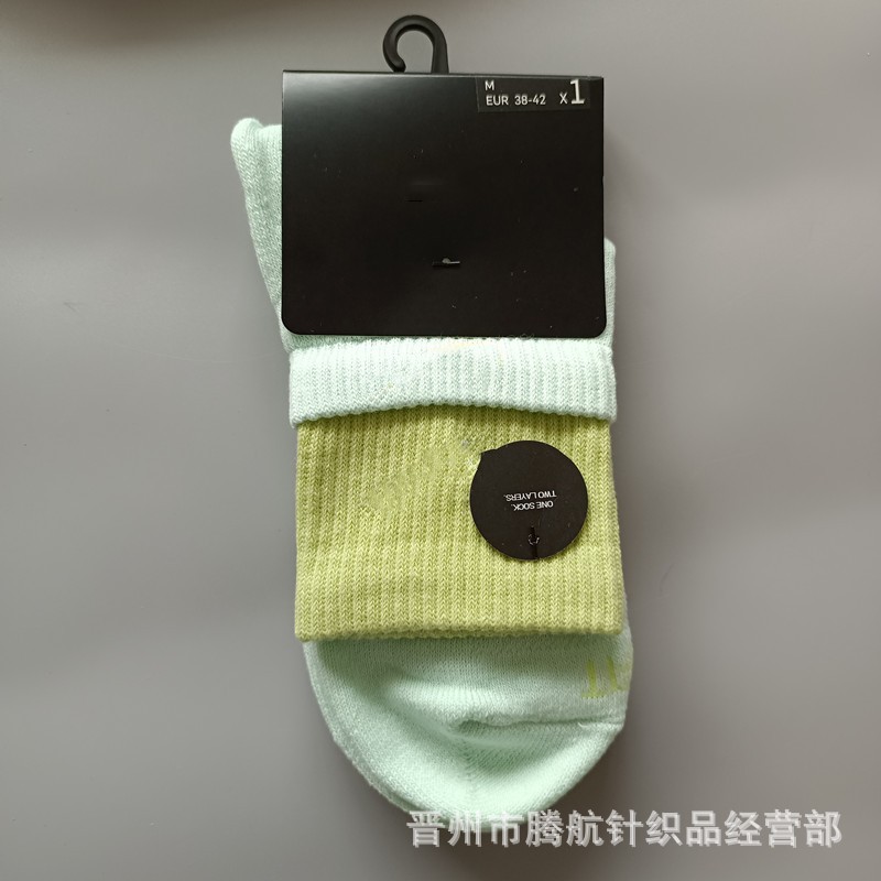 蘇万ナイキの靴下のカラーの二重は男女の中で長い筒のタオルの底のスポーツの靴下をつなぎ合わせてバスケットボールの靴下を走ります。