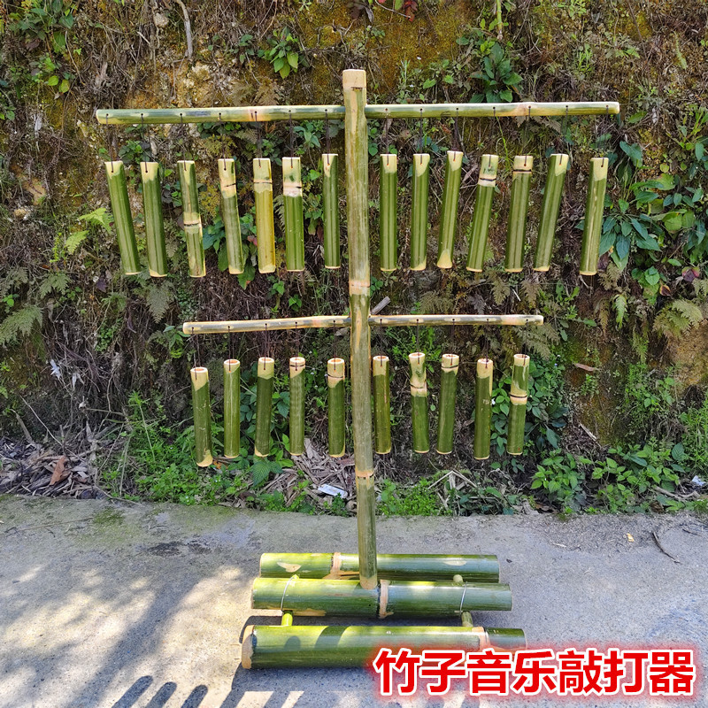 Materials for kindergarten music area: children's homemade musical instruments, bamboo percussion instruments, bamboo wind chimes, bamboo harps, toys