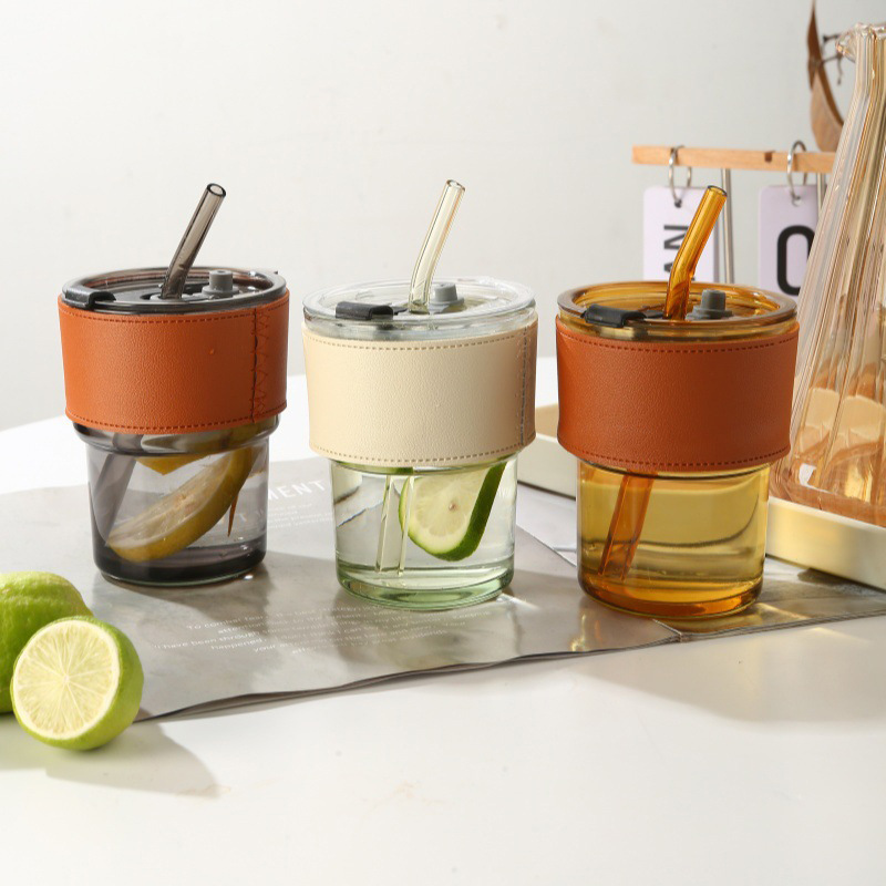 Tazas de vidrio de bambú en línea resistentes al calor tazas de paja de café ins viento alto valor de mano impresión de tazas de agua de regalo