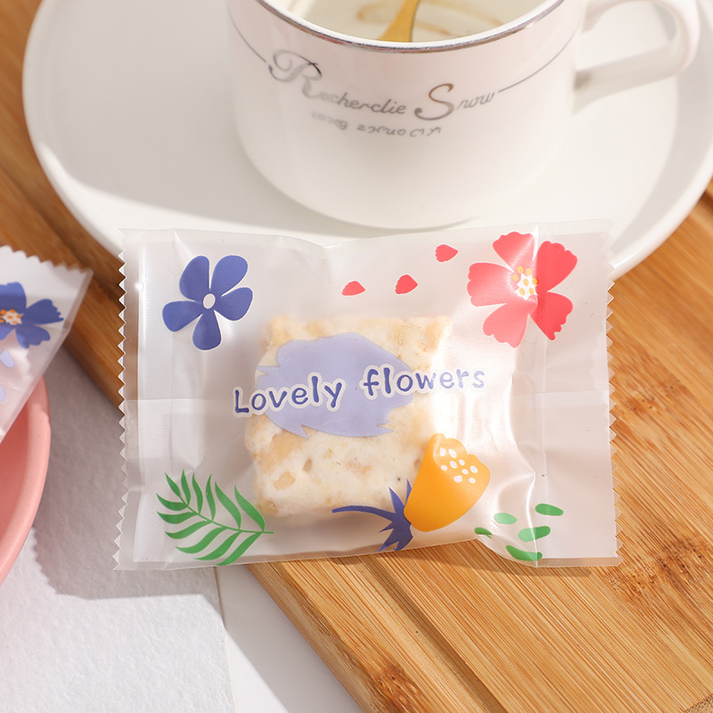 Frosted copo de nieve crujiente bolsa de embalaje hornear postre galleta pequeña bolsa de galletas dulces leche Jujube beef biscuit machine Seal bolsa