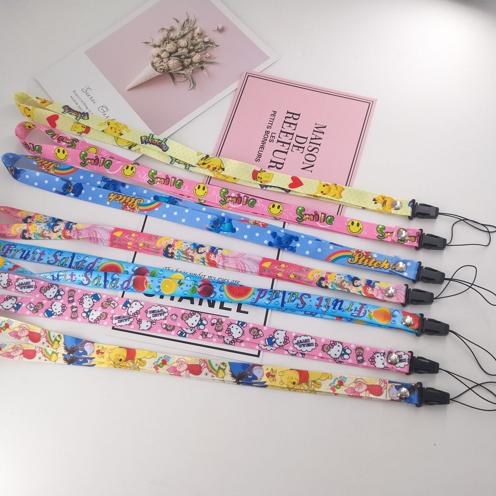 Cordón de teléfono móvil de dibujos animados Cordón de serie resistente a la caída Cordón de dibujos animados lindo cordón creativo floral requiere al por mayor