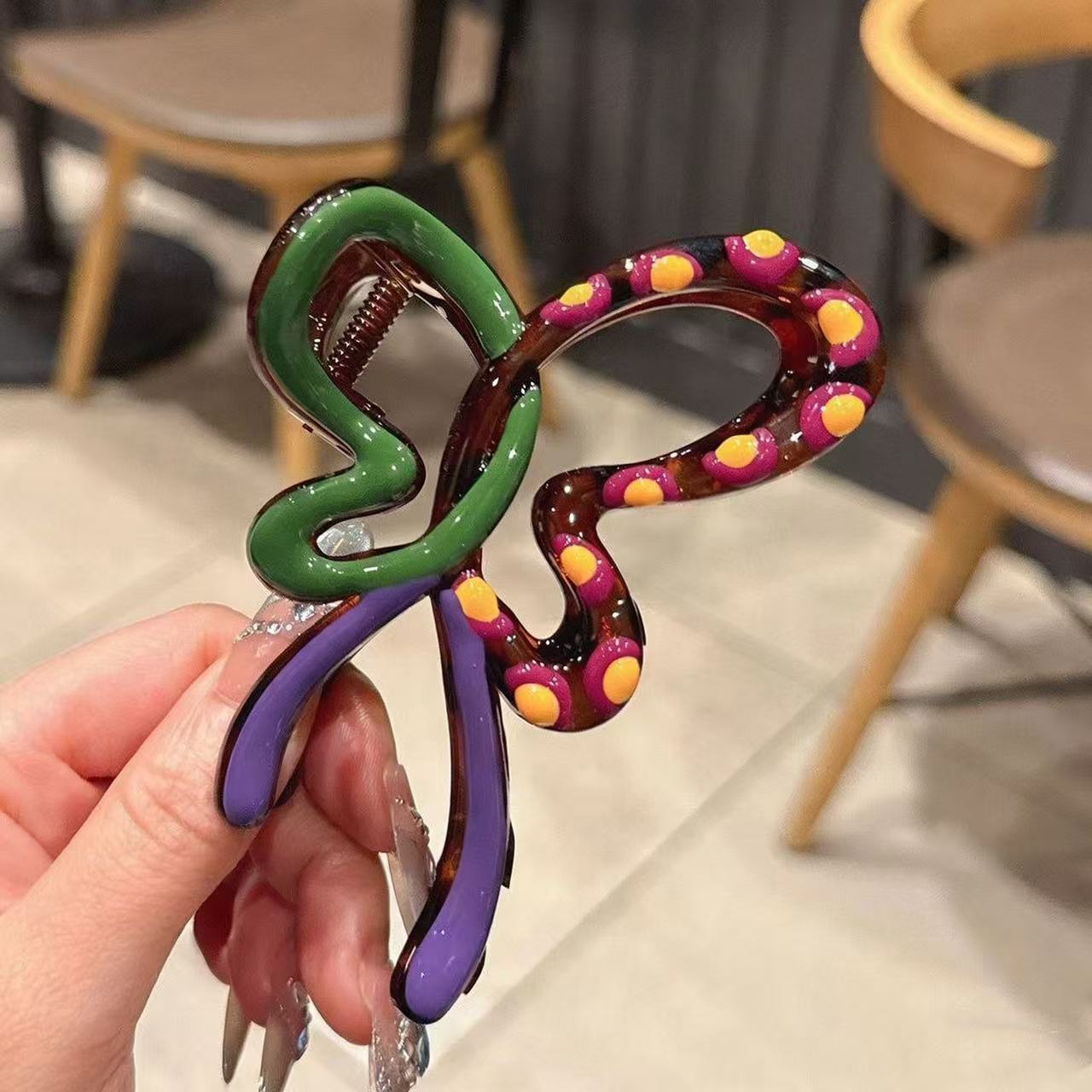 Purple and green contrasting butterfly gripper