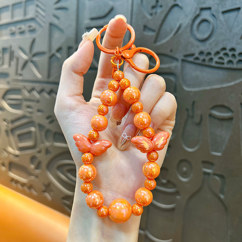 Sala de transmisión directa con alas recuerdos llaveros lindos colgantes de teléfonos móviles accesorios de bolsos llaveros de automóviles al por mayor