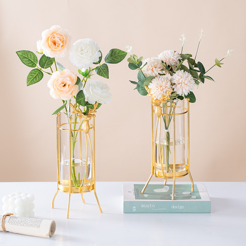 Fábrica al por mayor venta caliente florero ins estilo de hierro en forma de linterna florero hidropónico Luz de lujo de hierro florero de vidrio hogar