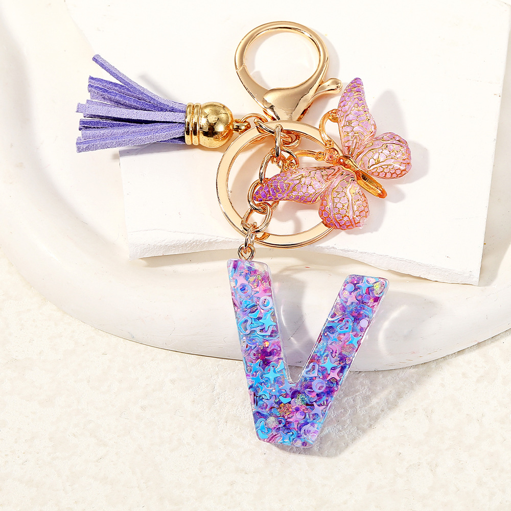 Mayorista transfronterizo mariposa esquinilla iniciales llavero de cristal goteo llavero de letras bolsos colgante