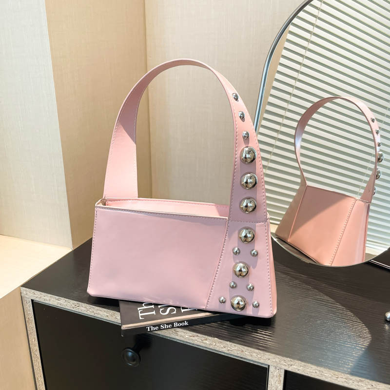 Bolso de axila de textura transfronteriza 2025 verano nuevo bolso femenino de diseño de nicho bolso de hombro con remaches personalizado marea