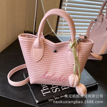 编织包包女大容量2025新款潮沙滩度假单肩包手拎斜挎水桶包草编包