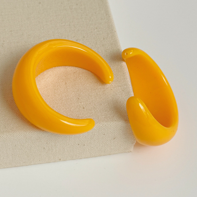 A pair of bright yellow [big hole punching accessories]