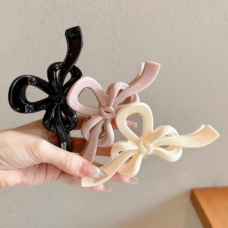 Temperamento arco flotante clip para el cabello de mujer cantidad de diseño de clip de tiburón tarjeta de cabello detrás de la cabeza agarrar clip para el cabello