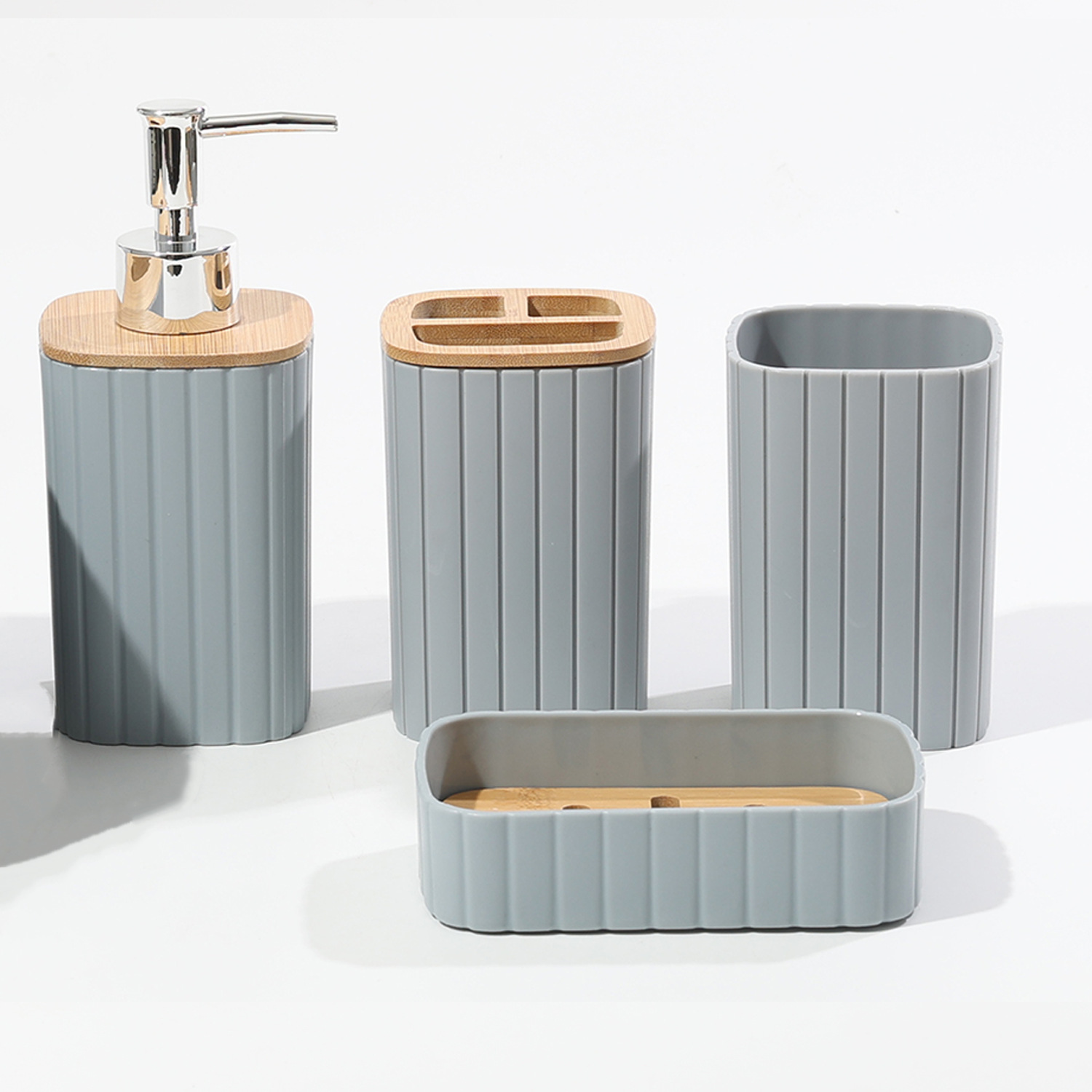 Baños de plástico a rayas transfronterizas cubierta de madera para lavar el hogar botella de emulsión boca taza de caja de jabón hotel set de 4 piezas