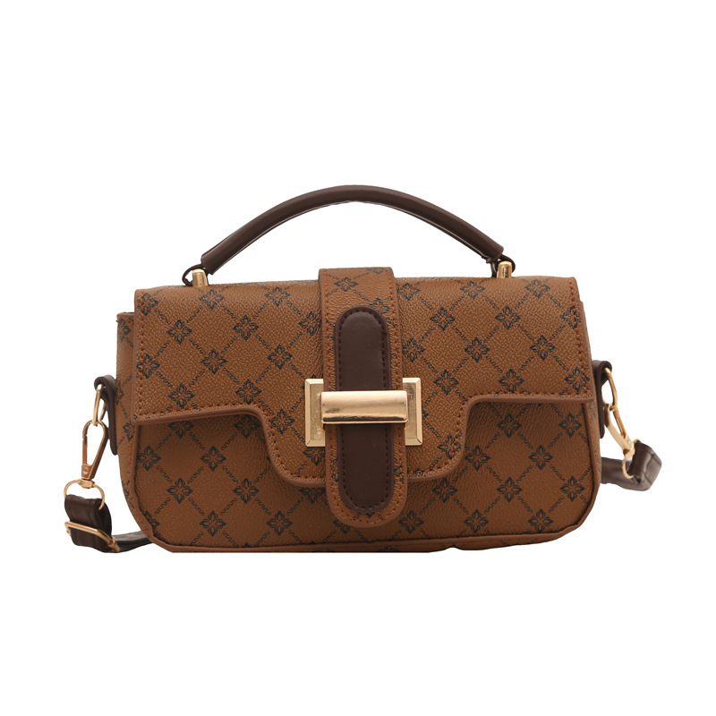 Bagos de color retro retro de estilo extranjero mujeres 2025 nuevo nicho diseño de empalme bolso pequeño bolso portátil de viaje