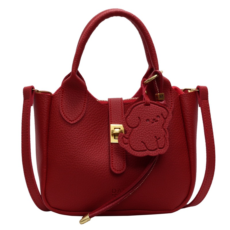 Este año, la popular explosión de la bolsa de cestas de verduras de mano para mujeres 2025 nuevo simple ocio de alta sensación bolso de cubo de transporte