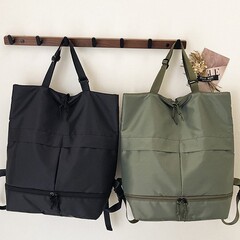 国境を越えた卸売 u ファミリー同じスタイルの男性と女性の大容量防水ナイロンハンドバッグショルダートートバッグバックパックバックパック