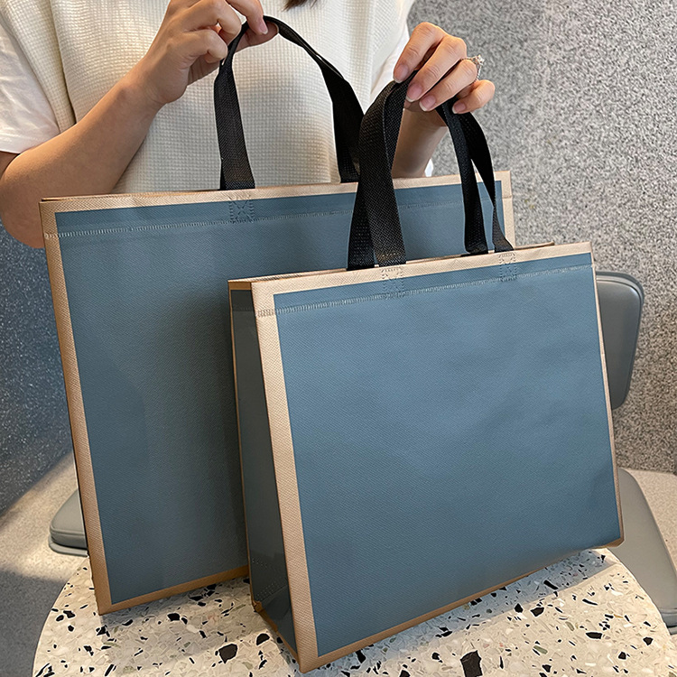 In stock non-woven film wholesale LOGO production color printing color portable shopping promotional clothing waterproof bag