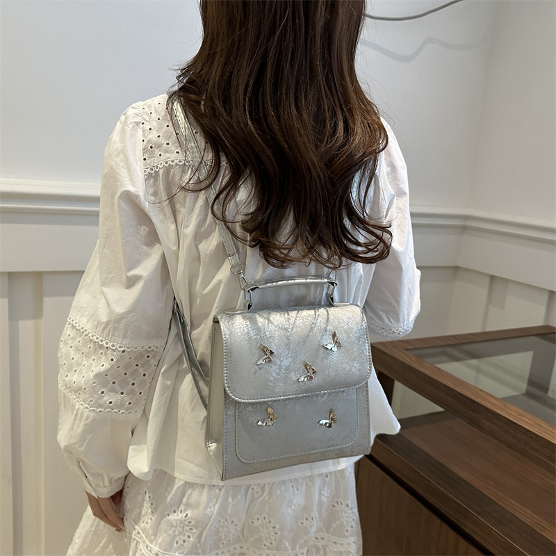 Mochila de mujer casual de estilo exterior versátil 2024 verano nuevo viaje de alta calidad mariposa mini mochila