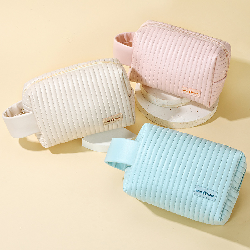 Nuevo pastel transfronterizo de octogón bolsas de maquillaje bolsas de maquillaje color caramelo bolsas de almacenamiento de viaje gran capacidad sensación de alta calidad al por mayor
