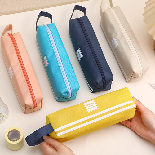 Japanese simple large-capacity pencil bag wholesale student portable pencil bag creative solid color Oxford cloth pencil bag