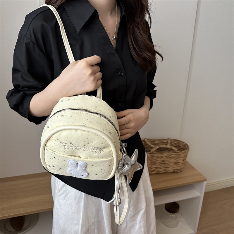 Nicho colegio estilo mochila portátil mujer 2026 nueva moda simple dibujos animados versátil viaje ocio mochila de moda