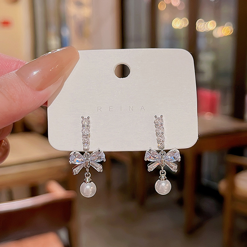 S925 aguja de plata exquisito circón arco pendientes de las mujeres de la borla larga versátil elegante perla pendientes al por mayor image 1