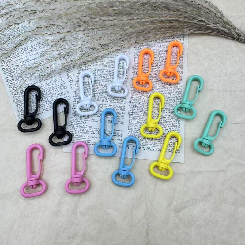 Factory Direct Sales Colorfulful Plastic Dog Buckle Backpack with Hook Buckle Pom Hanging Buckle Plastic Dog Buckle Water Kettle Rotating Keychain